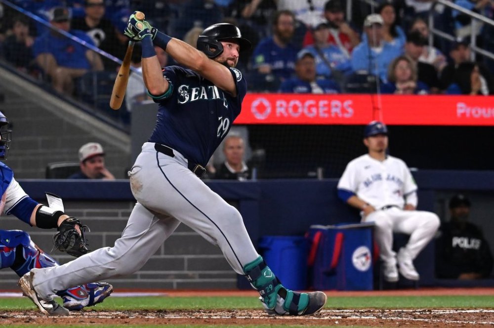 Seattle Mariners catcher Cal Raleigh (29) hits a two-run double against the Toronto Blue Jays in fifth inning American League baseball action in Toronto on Saturday, April 19, 2025. THE CANADIAN PRESS/Jon Blacker