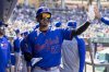 New York Mets' Mark Vientos (27) celebrates in the dugout after scoring during the seventh inning of a baseball game against the Athletics Sunday, April 13, 2025, in West Sacramento, Calif. (AP Photo/Sara Nevis)
