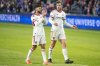 Toronto FC midfielder Jonathan Osorio (21) and defender Kevin Long (5) clap for fans after an MLS soccer match against FC Cincinnati, Saturday, March 8, 2025, in Cincinnati. (AP Photo/Tanner Pearson)