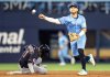 Toronto Blue Jays shortstop Bo Bichette (11) forces out Cleveland Guardians outfielder Angel Martínez (1) at second base as he tries to turn a double play during third inning MLB action in Toronto on Sunday May 4, 2025. THE CANADIAN PRESS/Frank Gunn