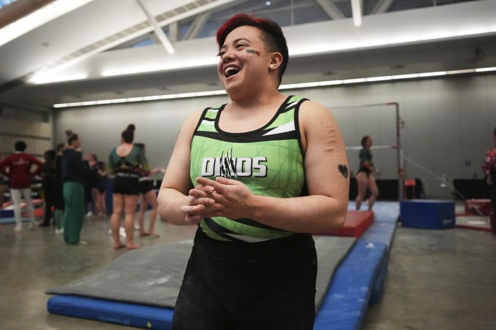 Raiden Hung of Jurassic Gymnastics from Boston, relaxes after competing on the uneven bars at the 2025 NAIGC national competition in Pittsburgh, Friday, April 4, 2025. (AP Photo/Gene J. Puskar)