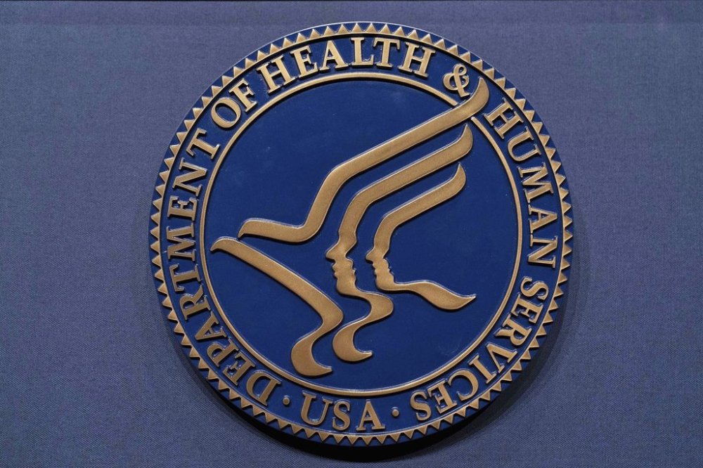 FILE - The Health and Human Services seal is seen before a news conference with Secretary Robert F. Kennedy Jr. in Washington, April 16, 2025. (AP Photo/Jose Luis Magana, File)