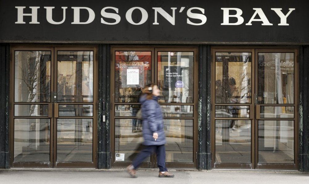 A pedestrian passes the Hudson's Bay store in downtown Calgary, Alta., Thursday, March 20, 2025. THE CANADIAN PRESS/Jeff McIntosh