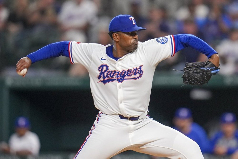 Texas Rangers starting pitcher Kumar Rocker throws a pitch to the Los Angeles Angels during the fifth inning of a baseball game Thursday, April 17, 2025, in Arlington, Texas. (AP Photo/Julio Cortez)