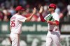 St. Louis Cardinals' Thomas Saggese, left, and Lars Nootbaar celebrate a victory over the Houston Astros following a baseball game Wednesday, April 16, 2025, in St. Louis. (AP Photo/Jeff Roberson)