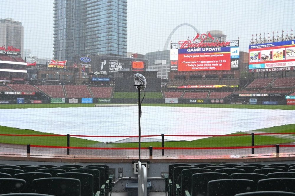 Water collects on the tarp as rain falls at Busch Stadium where the baseball between the St. Louis Cardinals and the New York Mets was postponed, Saturday, May 3, 2025, in St. Louis, for a doubleheader on Sunday. (AP Photo/Joe Puetz)