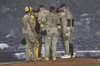 San Diego Padres players talk on the pitcher's mound during the fifth inning of a baseball game against the New York Yankees, Monday, May 5, 2025, in New York. (AP Photo/Pamela Smith)