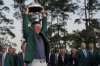 Winner Rory McIlroy, of Northern Ireland, holds the trophy at the Masters golf tournament, Sunday, April 13, 2025, in Augusta, Ga. (AP Photo/David J. Phillip)
