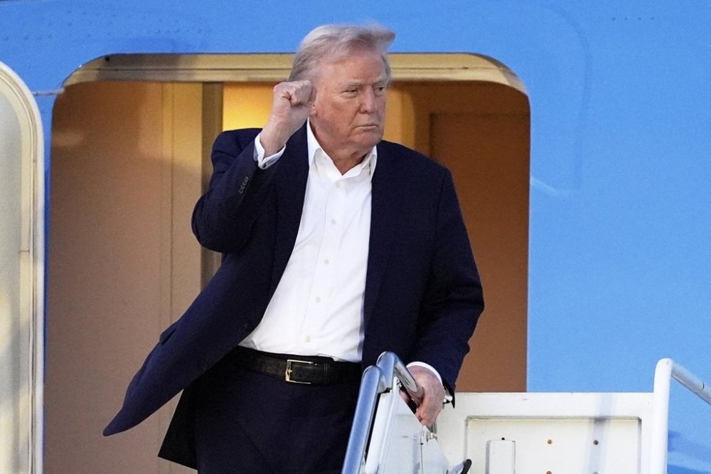 President Donald Trump arrives at Palm Beach International Airport, Friday, April 11, 2025, in West Palm Beach, Fla. (AP Photo/Manuel Balce Ceneta)