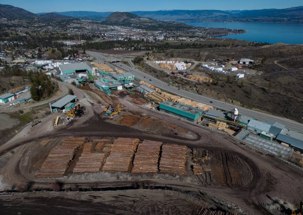 In an aerial view, logs are seen stacked at Gorman Brothers Lumber sawmill, in West Kelowna, B.C., on Friday, April 4, 2025. THE CANADIAN PRESS/Darryl Dyck