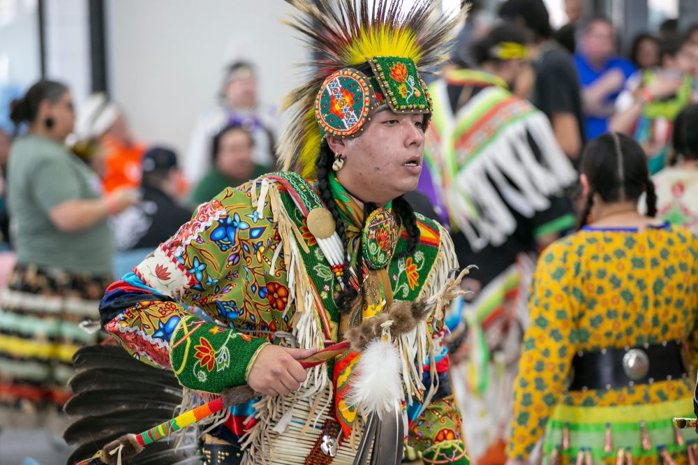 BROOK JONES/FREE PRESS
Daysin Copenance, 23, wears his regalia as he dances during Thursday's powwow.