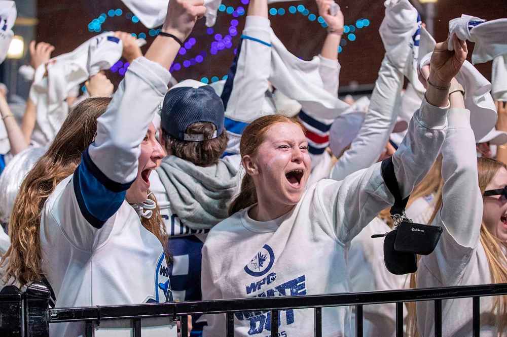 BROOK JONES / FREE PRESS
Winnipeg Jets fans Leah Clausser (middle), Gabbry Robbins (left) and Kennedy Peters cheer after the Jets score their team's first goal of the Game 5 in the National Hockey League Stanley Cup playoff between the hometown Winnipeg Jets and the visiting St. Louis Blues in Winnipeg, Man., Saturday.