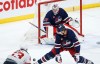 Winnipeg Jets goaltender Connor Hellebuyck (37) keeps his eye on the shot from New Jersey Devils' Jesper Bratt (63) as Jets' Luke Schenn (5) defends during second period NHL action in Winnipeg on Friday, March 28, 2025. THE CANADIAN PRESS/John Woods