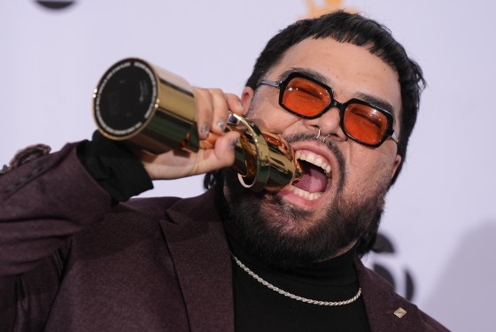 Sebastian Gaskin poses for photos after winning the Contemporary Indigenous Artist or Group of the Year award during the Juno Awards Gala in Vancouver. (Darryl Dyck / Canadian Press files)