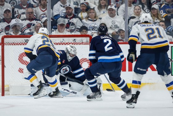 Winnipeg Jets goaltender Connor Hellebuyck (37) saves the breakaway shot from St. Louis Blues' Jordan Kyrou (25) during Saturday's game. (John Woods/The Canadian Press files)