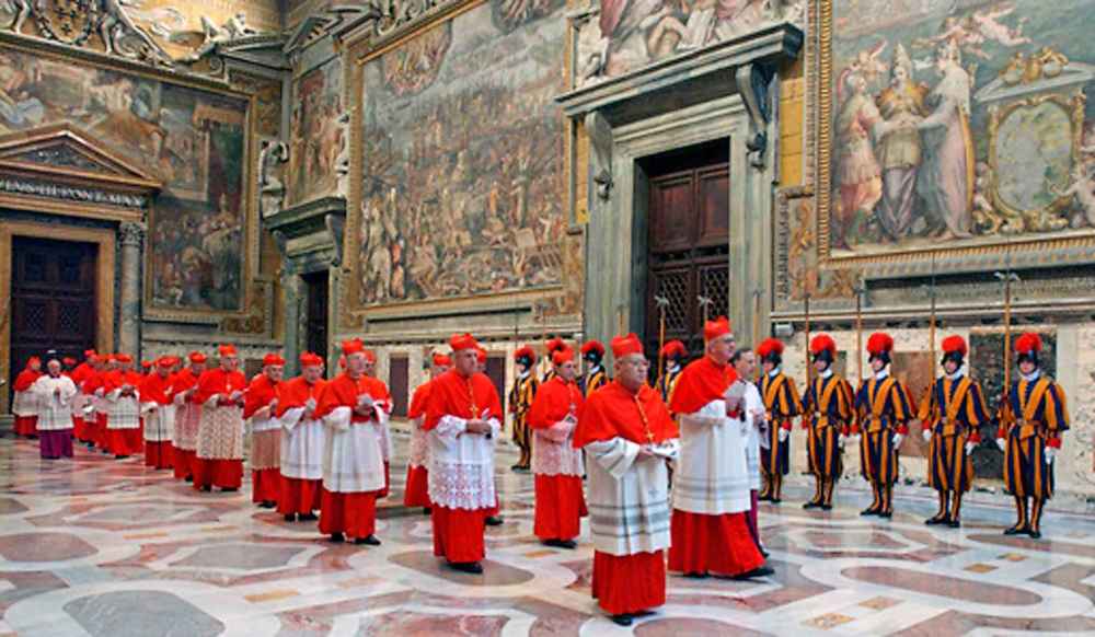 FILE - In this photo from files taken on April 18, 2005 and released by the Vatican paper L'Osservatore Romano, Cardinals walk in procession to the Sistine Chapel at the Vatican, at the beginning of the conclave. (Osservatore Romano via AP, File)
