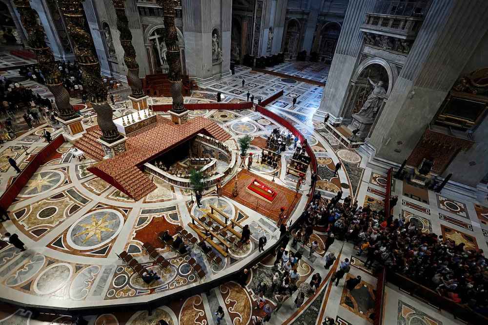 People queue to pay their respect to the late Pope Francis, who will lie in state at St. Peter's Basilica for three days, at the Vatican, Wednesday, April 23, 2025. (Cecilia Fabiano/LaPresse via AP)