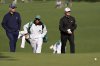 Rasmus Hojgaard, right, and Nicolai Hojgaard walk to the green on the seventh hole during a practice around at the Masters golf tournament, Wednesday, April 9, 2025, in Augusta, Ga. (AP Photo/Ashley Landis)