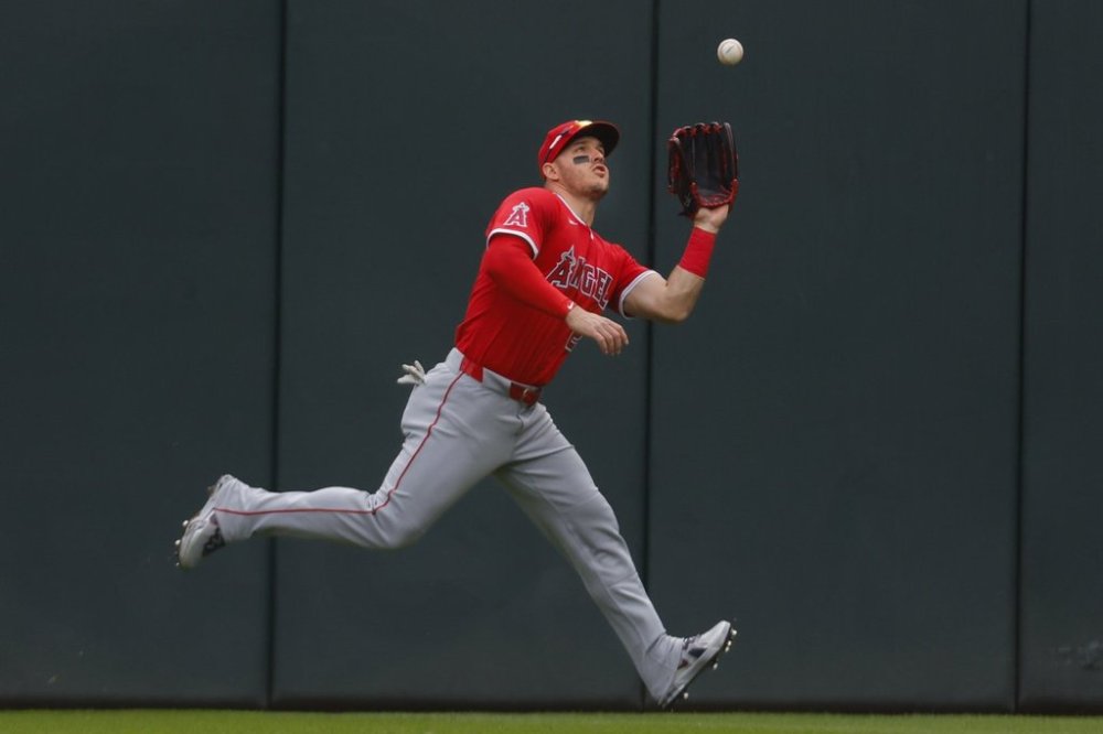 Los Angeles Angels right fielder Mike Trout catches a fly ball hit by Minnesota Twins' Ryan Jeffers in the fourth inning of a baseball game Sunday, April 27, 2025, in Minneapolis. (AP Photo/Bruce Kluckhohn)