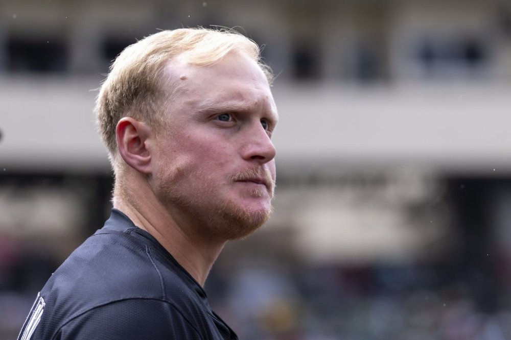 Chicago White Sox's Andrew Vaughn watches the outfield from the dugout during the sixth inning of a baseball game against the Athletics, Saturday, April 26, 2025, in West Sacramento, Calif. (AP Photo/Sara Nevis)