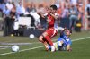 Berlin's Rani Khedira, left, and Bochum's Cristian Gamboa, right, challenge for the ball during the German Bundesliga soccer match between VfL Bochum and 1. FC Union Berlin in Bochum, Germany, Sunday, April 27, 2025. (David Inderlied/dpa via AP)