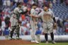Arizona Diamondbacks' Jose Herrera, left, Jalen Beeks, center, and Josh Naylor, right, celebrate after defeating the Philadelphia Phillies in a baseball game, Sunday, May 4, 2025, in Philadelphia. (AP Photo/Matt Rourke)