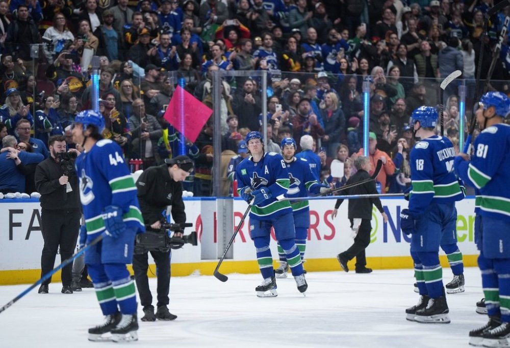 Vancouver Canucks' Brock Boeser, centre, and his teammates skate off the ice after saluting the crowd after playing the Vegas Golden Knights in their final NHL hockey game of the season, in Vancouver, on Wednesday, April 16, 2025. THE CANADIAN PRESS/Darryl Dyck