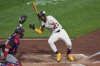 Pittsburgh Pirates' Andrew McCutchen (22) gets out of the way of a high and inside pitch from Washington Nationals pitcher Jorge López during the seventh inning of a baseball game in Pittsburgh, Wednesday, April 16, 2025. (AP Photo/Gene J. Puskar)