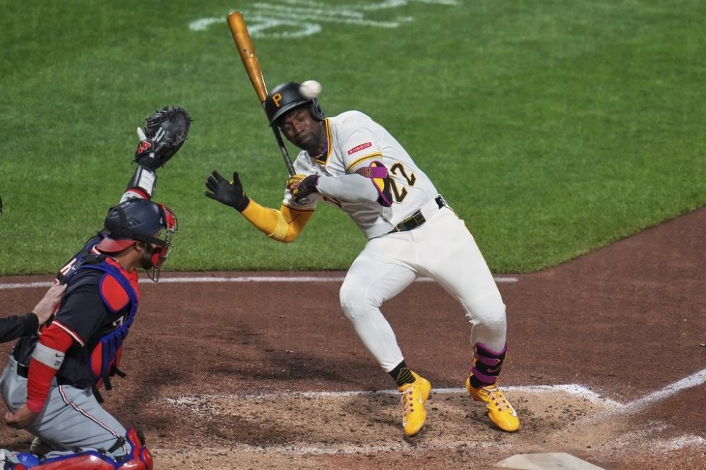 Pittsburgh Pirates' Andrew McCutchen (22) gets out of the way of a high and inside pitch from Washington Nationals pitcher Jorge López during the seventh inning of a baseball game in Pittsburgh, Wednesday, April 16, 2025. (AP Photo/Gene J. Puskar)