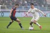 Genoa's Morten Frendrup, left, fights for the ball with AC Milan's Alex Jimenez during the Serie A soccer match between Genoa and Milan at the Luigi Ferraris Stadium in Genoa, Italy, Monday, May 5, 2025. (Tano Pecoraro/Lapresse via AP)