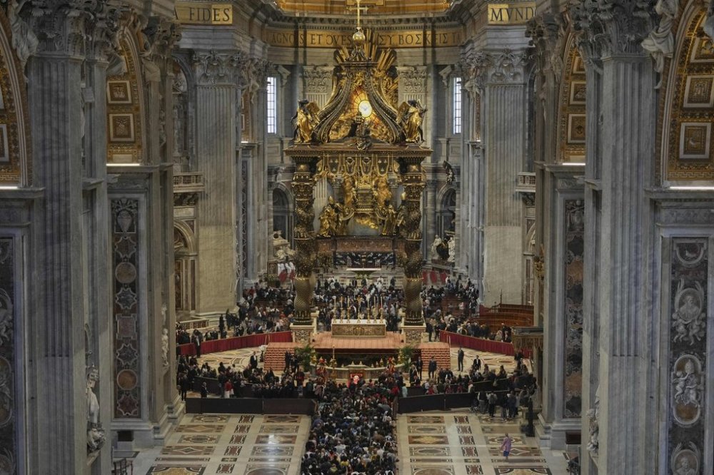 People line up to pay their respects to Pope Francis lying in state, inside St. Peter's Basilica, at the Vatican, Friday, April 25, 2025. (AP Photo/Andrew Medichini)