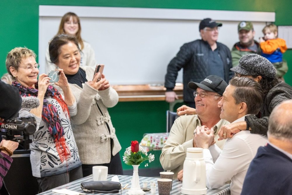 Conservative Leader Pierre Poilievre poses for photos with seniors at the Happy Gang Centre during a campaign stop in Terrace, B.C., on Monday, April 7, 2025. THE CANADIAN PRESS/Aaron Whitfield