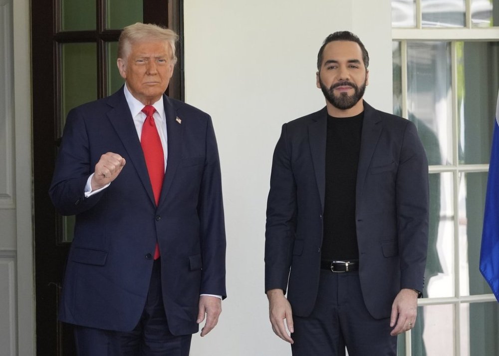 President Donald Trump, left, gestures as he greets El Salvador's President Nayib Bukele as Bukele arrives at the White House, Monday, April 14, 2025, in Washington. (AP Photo/Manuel Balce Ceneta)