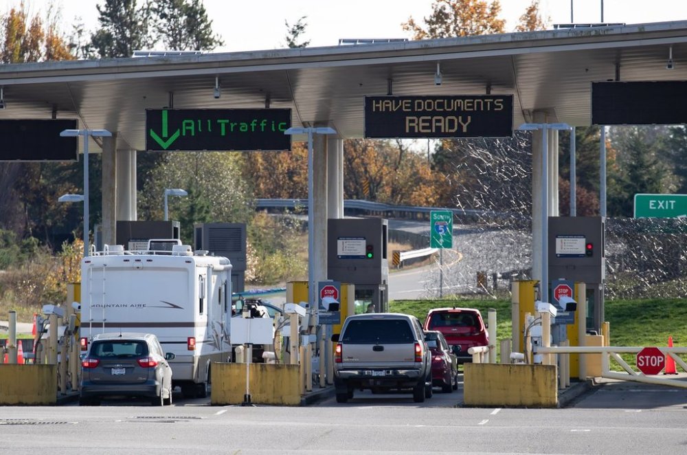 Motorists wait at U.S. Customs and Border Protection inspection booths at the Peace Arch border crossing in Blaine, Wash., across the Canada-U. S. border from Surrey, B.C., on Monday, Nov. 8, 2021. THE CANADIAN PRESS/Darryl Dyck