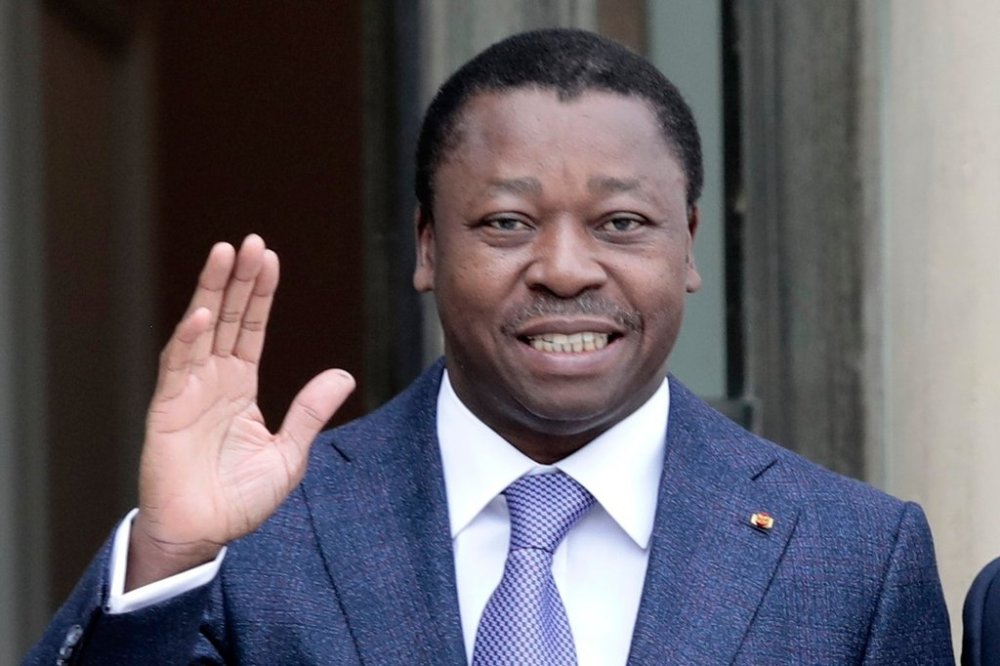 FILE - Togo's President Faure Gnassingbe waves before a working lunch at the Elysee Palace in Paris on April 9, 2021. (AP Photo/Lewis Joly, File)