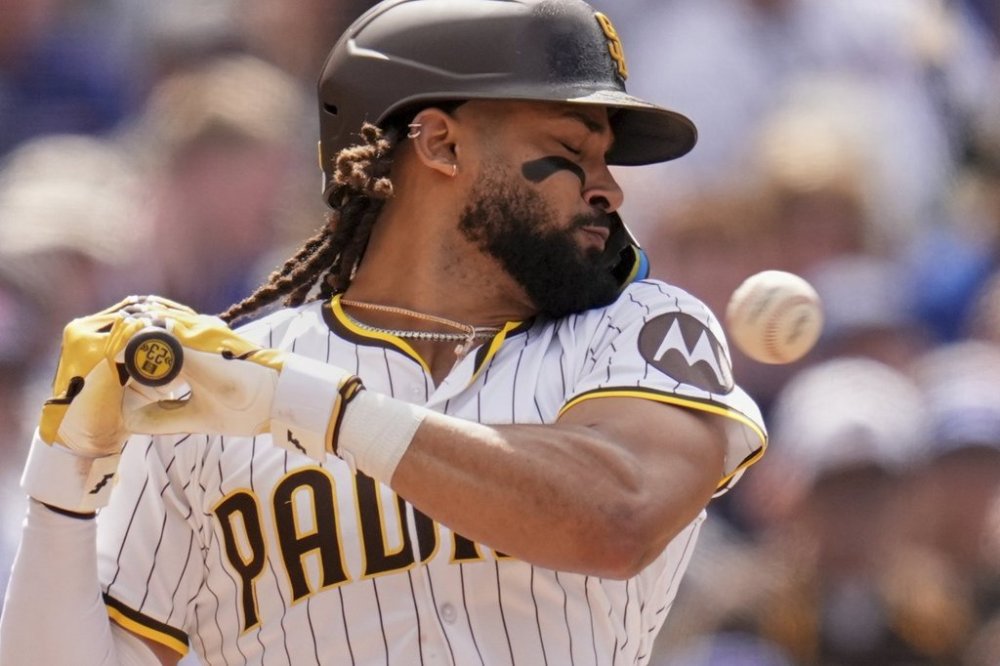 San Diego Padres' Fernando Tatis Jr. moves away from an inside pitch while batting during the seventh inning of a baseball game against the Chicago Cubs Wednesday, April 16, 2025, in San Diego. (AP Photo/Gregory Bull)