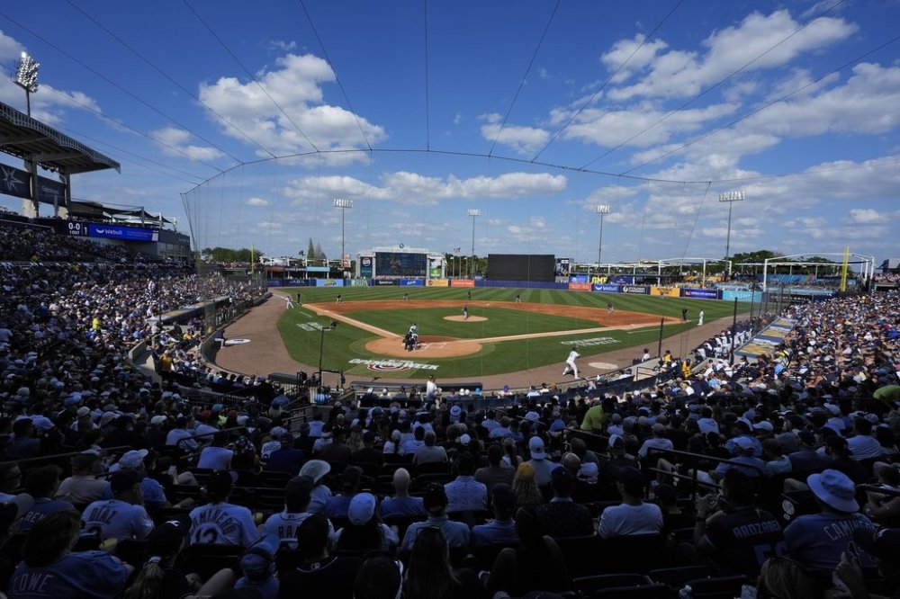 A sell out crowd watches during the second inning of a baseball game between the Tampa Bay Rays and the Colorado Rockies at Steinbrenner Field Friday, March 28, 2025, in Tampa, Fla. (AP Photo/Chris O'Meara)