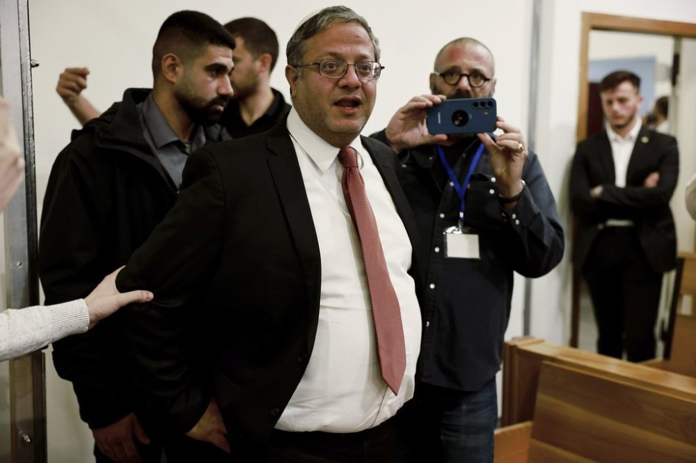 FILE - Israel's National Security Minister Itamar Ben Gvir, center, addresses the media as he enters a courtroom in Tel Aviv before the start of Prime Minister Benjamin Netanyahu's hearing Tuesday, Dec. 10, 2024. (Menahem Kahana/Pool Photo via AP, File)