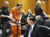 Zvi Levran, a doctor who was sentenced to at least 10 years in prison for sexual assault and other crimes involving adults and teenagers, is escorted out of the courtroom after his sentencing Tuesday, April 29, 2025, in Pontiac, Mich. (Clarence Tabb Jr./Detroit News via AP)