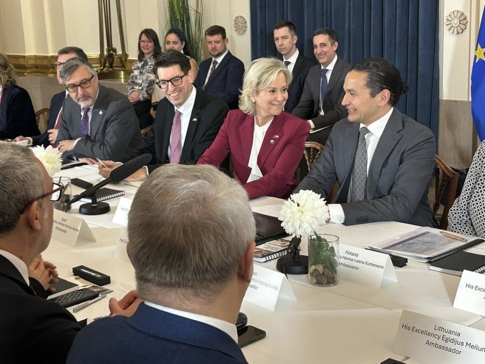 Genevieve Tuts, Ambassador of the European Union to Canada, centre, and other representatives of European Union countries met with Manitoba Premier Wab Kinew, right, at the Manitoba legislature in Winnipeg on Tuesday, April 15, 2025. THE CANADIAN PRESS/Steve Lambert