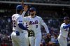 New York Mets Brandon Nimmo (9) celebrates his leaping catch against the St. Louis Cardinals during Cardinals' Jordan Walker's ball, resulting in Walker flying out during the sixth inning of a baseball game, Sunday, April 20, 2025, in New York. (AP Photo/Angelina Katsanis)