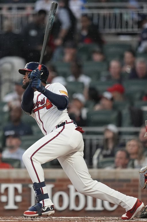 Atlanta Braves outfield Bryan De La Cruz (14) hits a double against the Philadelphia Phillies in the second inning of a baseball game, Thursday, April 10, 2025, in Atlanta. (AP Photo/Mike Stewart)