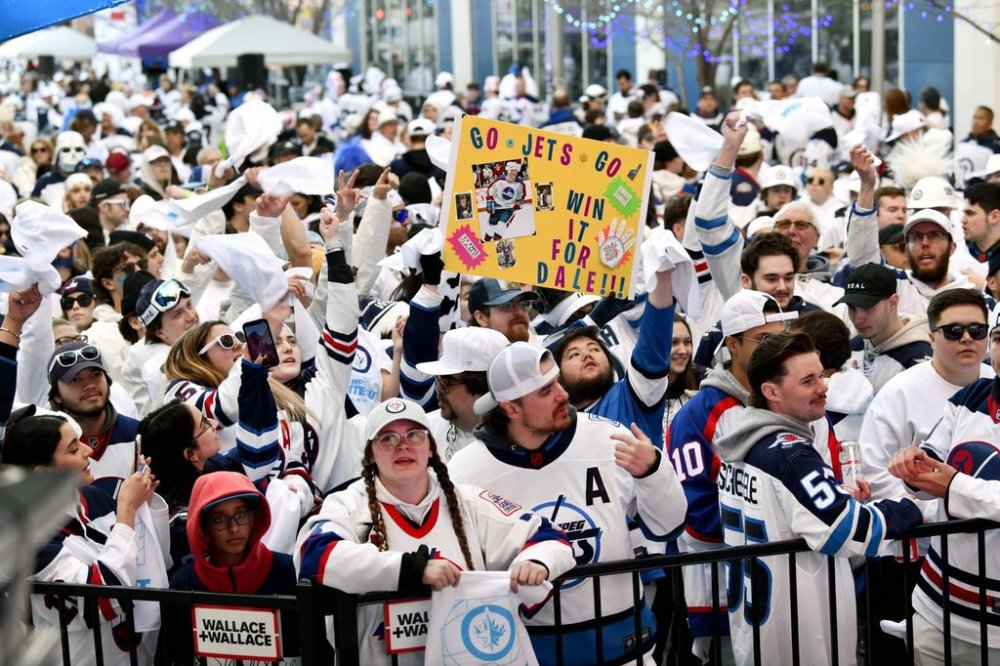 Winnipeg Jets fans attend a street party prior to game 2 of the NHL hockey Stanley Cup first-round playoff series against the Colorado Avalanche in Winnipeg, Tuesday, April 23, 2024. THE CANADIAN PRESS/Fred Greenslade