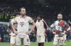 Bayern's Harry Kane, left, reacts at the end of the Champions League quarterfinal second leg soccer match between Inter Milan and Bayern Munich at the San Siro stadium in Milan, Italy, Wednesday, April 16, 2025. (AP Photo/Antonio Calanni)