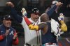 Atlanta Braves designated hitter Marcell Ozuna (20) celebrates his walk-off two-run homer against the Philadelphia Phillies in the 11th inning of a baseball game after a rain delay, Friday, April 11, 2025, in Atlanta. (AP Photo/Mike Stewart)