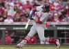 St. Louis Cardinals' Brendan Donovan hits an RBI single during the third inning of the second baseball game of a doubleheader against the Cincinnati Reds, Wednesday, April 30, 2025, in Cincinnati. (AP Photo/Jeff Dean)