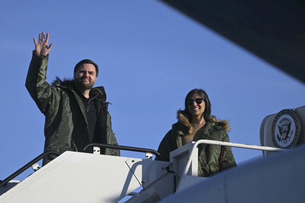 Vice President JD Vance, left, and second lady Usha Vance, board Air Force Two as they depart after touring Pituffik Space Base, Friday, March 28, 2025, in Greenland. (Jim Watson/Pool via AP)
