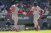 Boston Red Sox's Romy Gonzalez, left, congratulates Ceddanne Rafaela, right, on his three-run home run off Cleveland Guardians relief pitcher Joey Cantillo during the seventh inning of a baseball game Sunday, April 27, 2025, in Cleveland. (AP Photo/Phil Long)