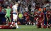 FILE - Tottenham's Harry Kane walks past Liverpool's players as they celebrate after winning the Champions League final soccer match against Tottenham Hotspur at the Wanda Metropolitano Stadium in Madrid, Saturday, June 1, 2019. (AP Photo/Felipe Dana, file)