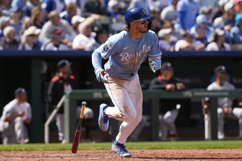 Kansas City Royals' Bobby Witt Jr. watches his sacrifice fly to score one run during the seventh inning of a baseball game against the Minnesota Twins, Thursday, April 10, 2025, in Kansas City, Mo. (AP Photo/Charlie Riedel)